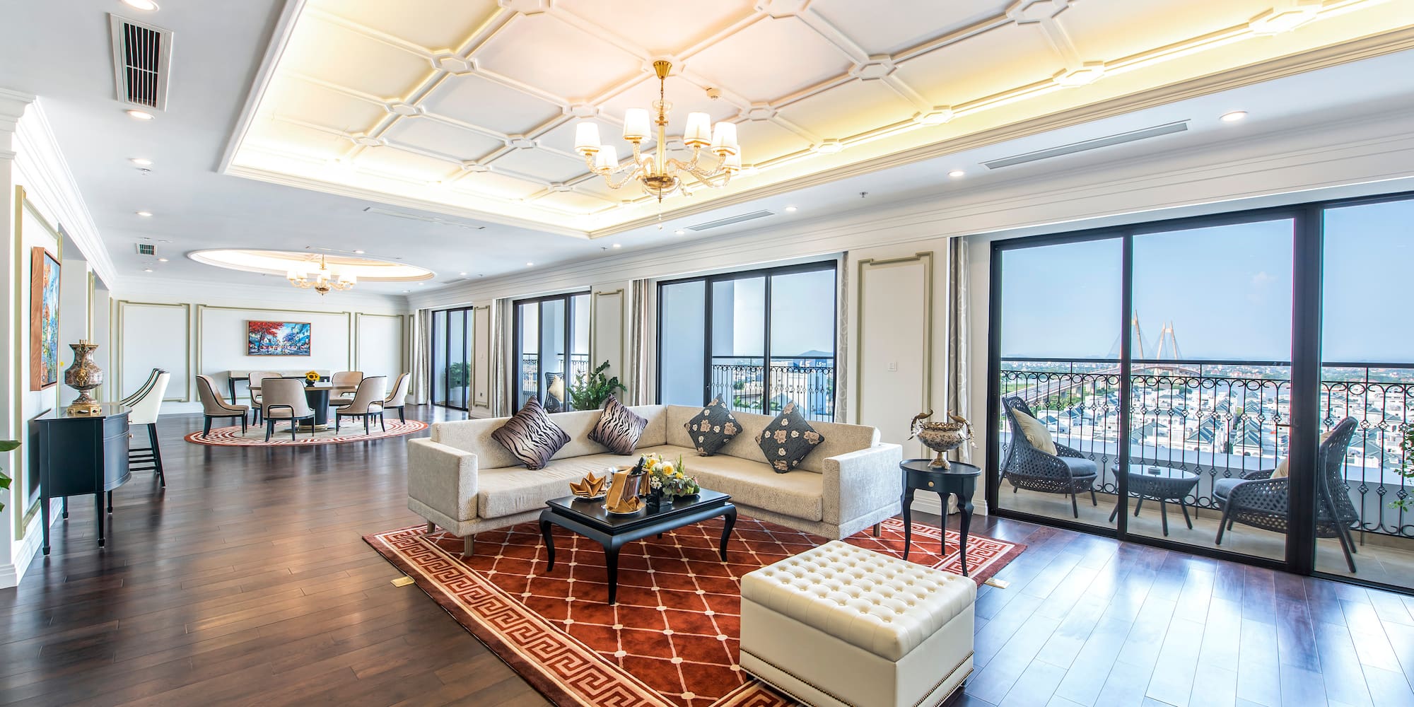 a living room with a large window and a balcony