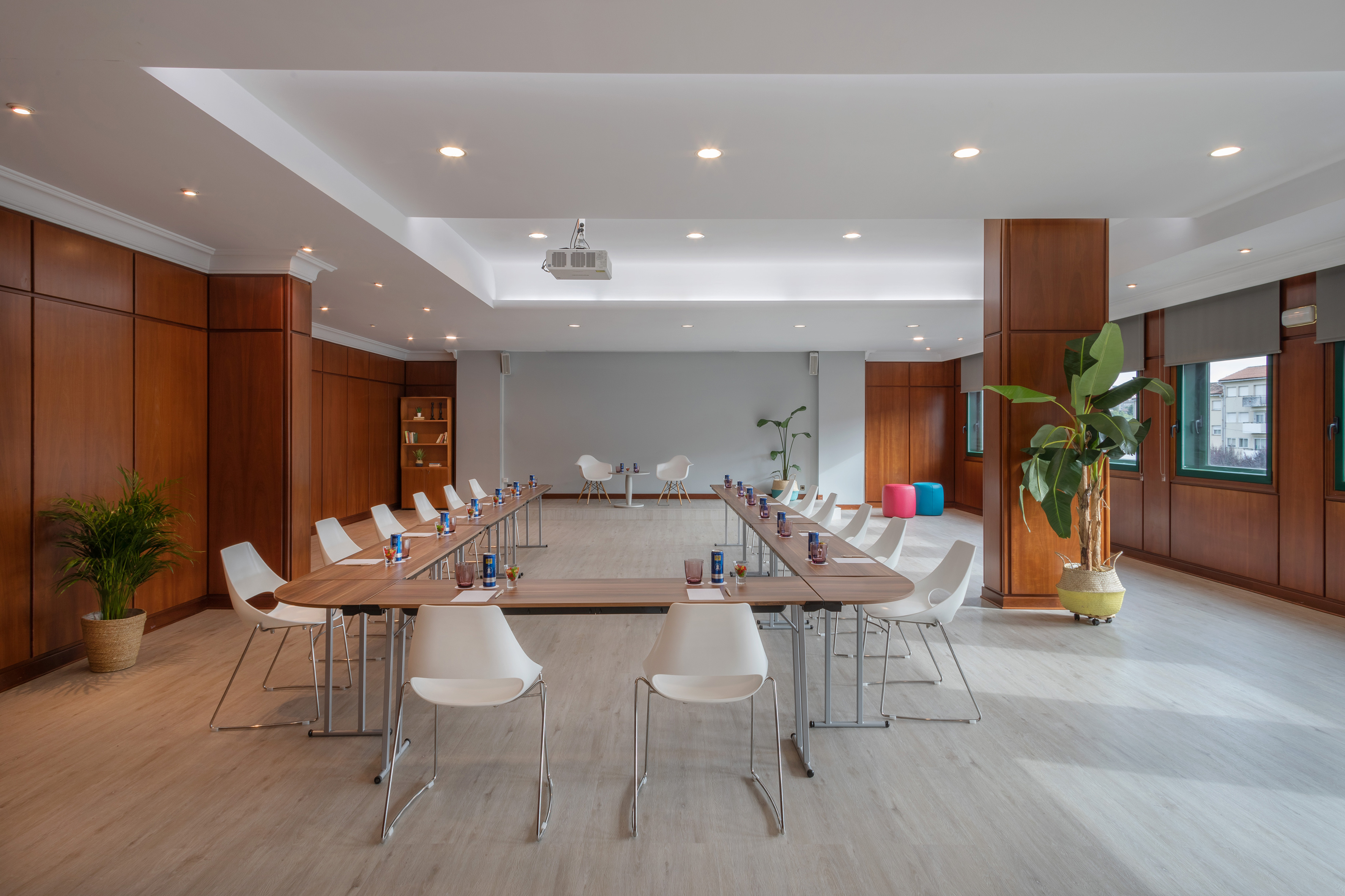 a room with a long table and chairs