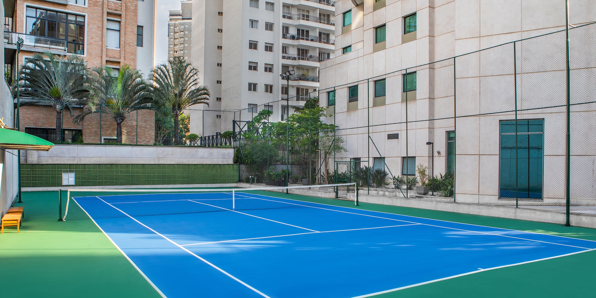 a tennis court in a city