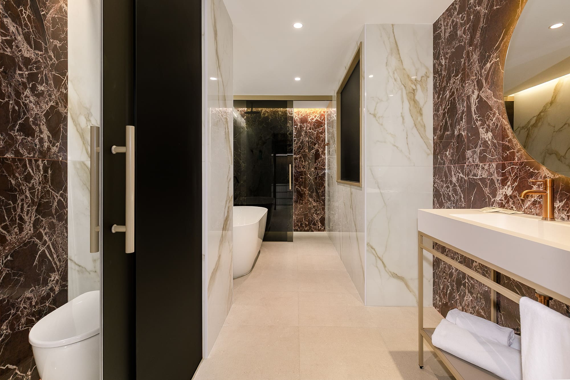 a bathroom with marble walls and a sink