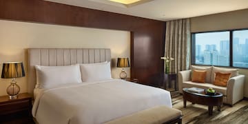 a room with a bed and a chair