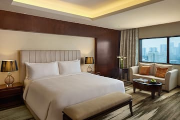 a room with a bed and a chair