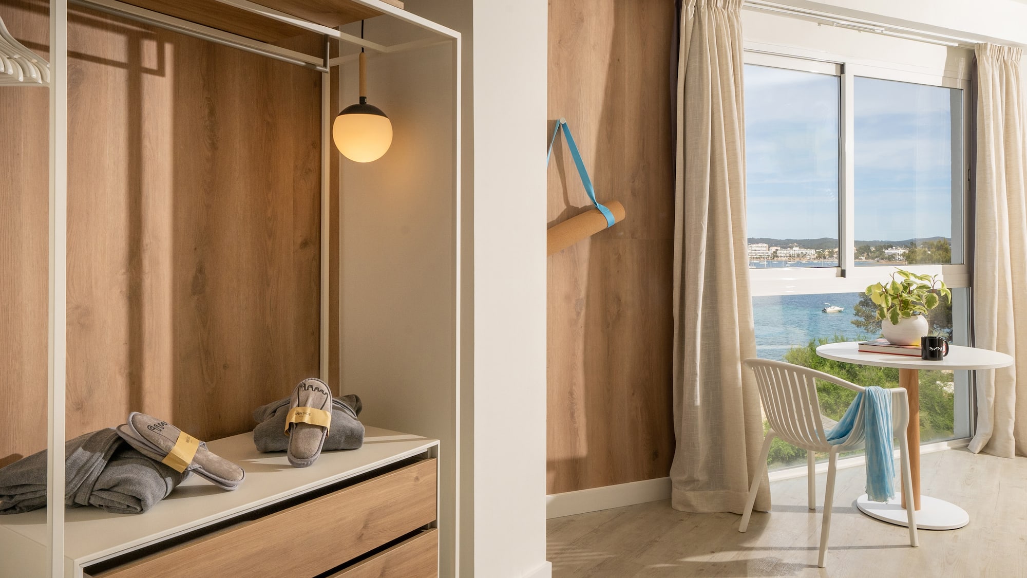 a room with a closet and a chair and a table