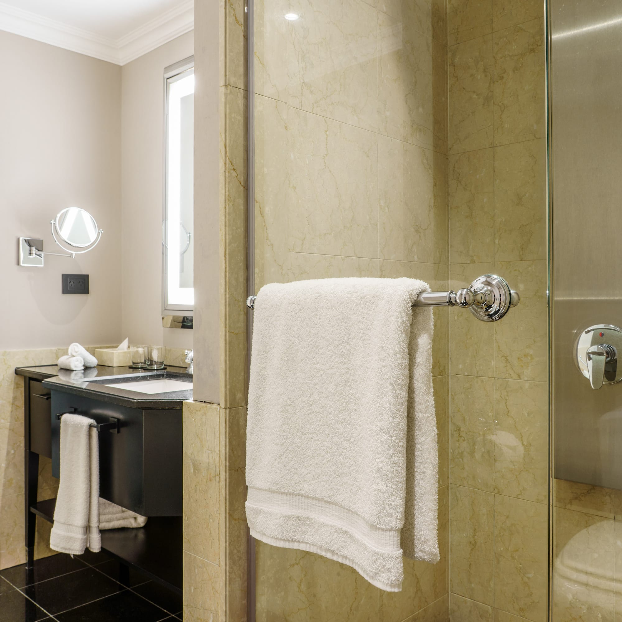 a bathroom with a shower and a sink