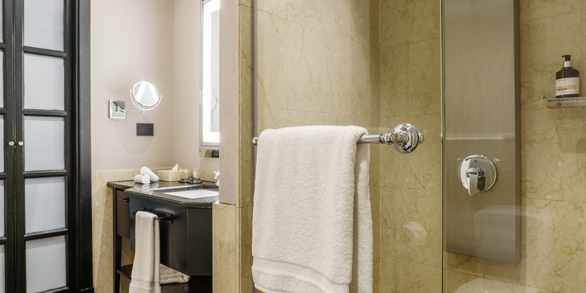 a bathroom with a shower and a sink