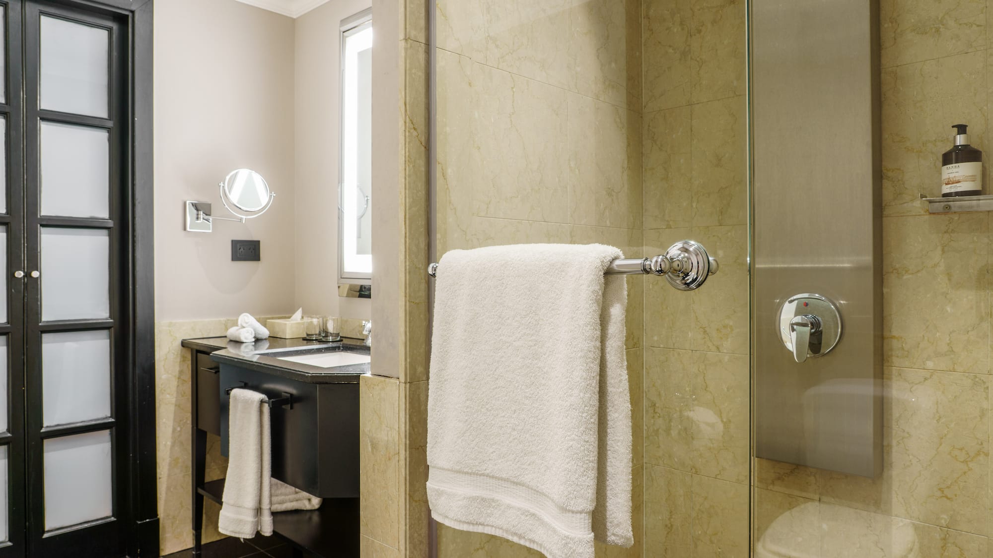 a bathroom with a shower and a sink