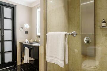 a bathroom with a shower and a sink