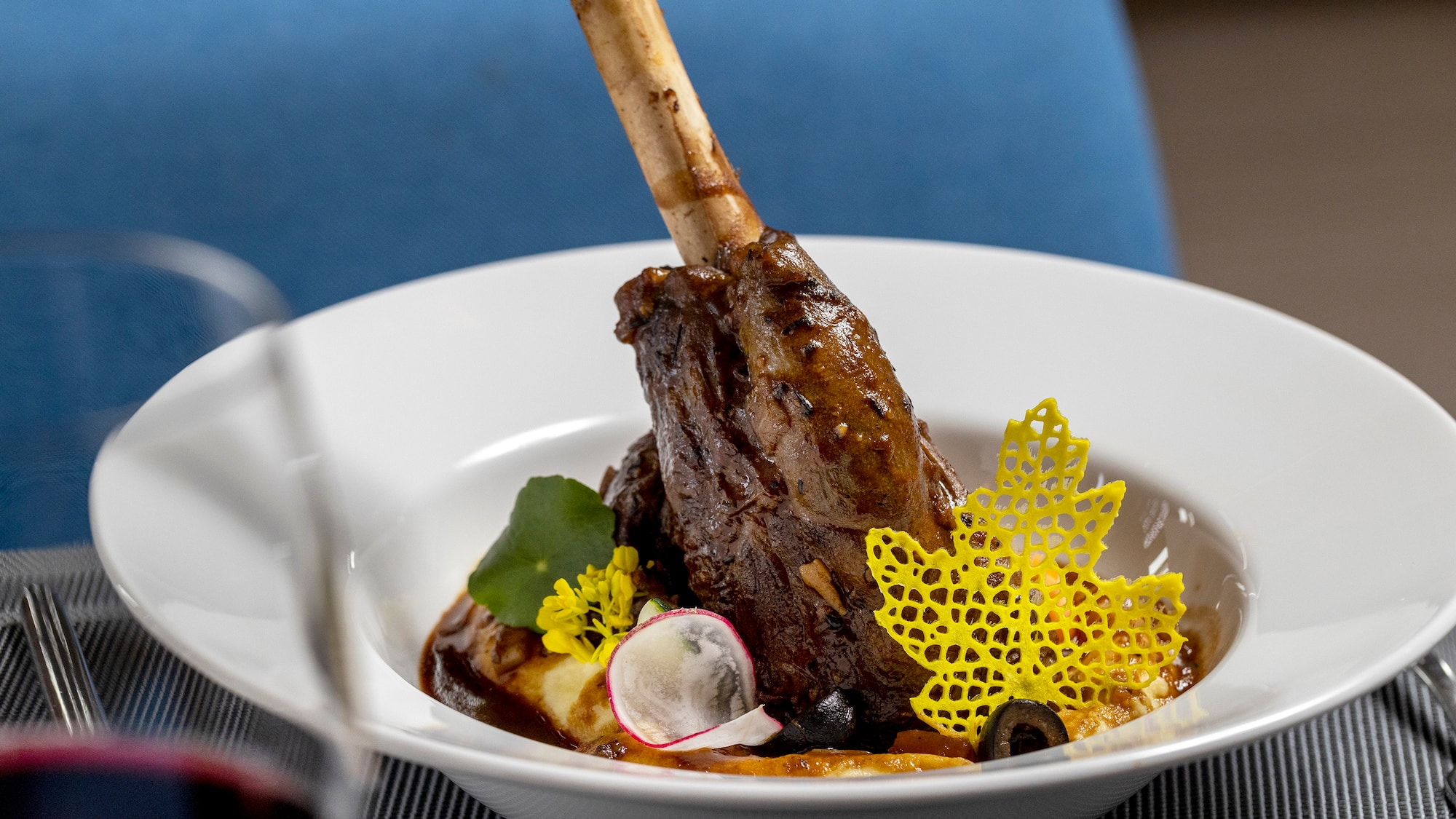 a bowl of food with a bone on the leg