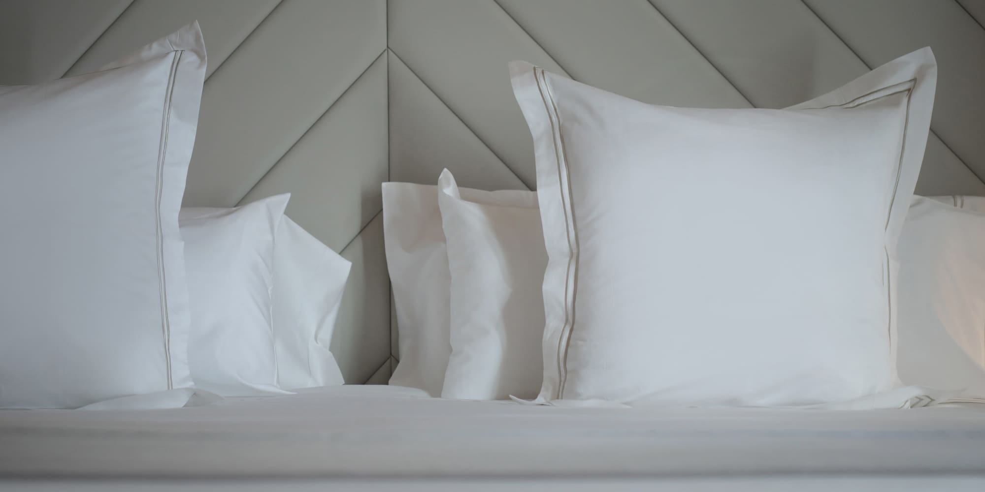 a bed with white pillows