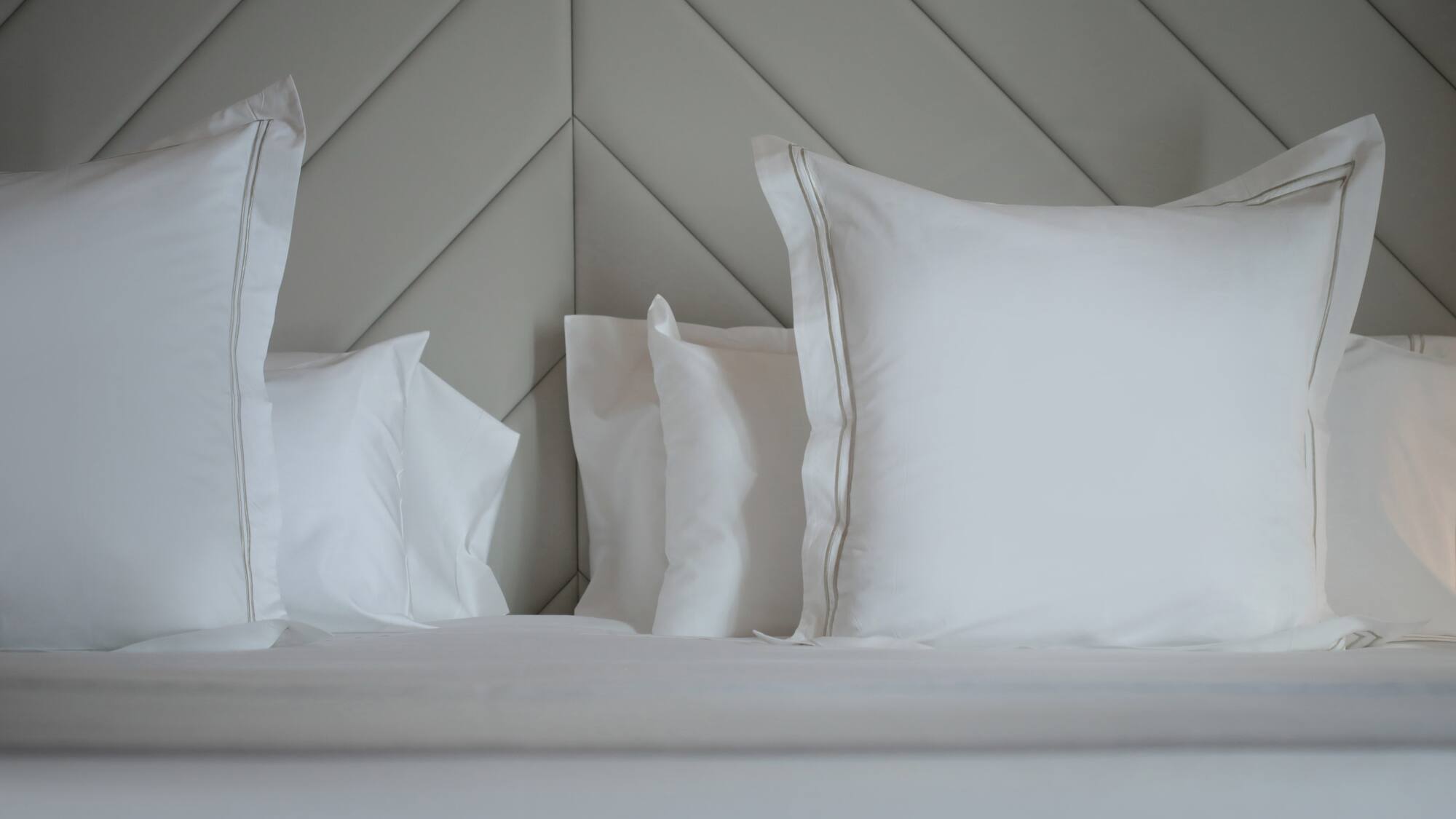 a bed with white pillows