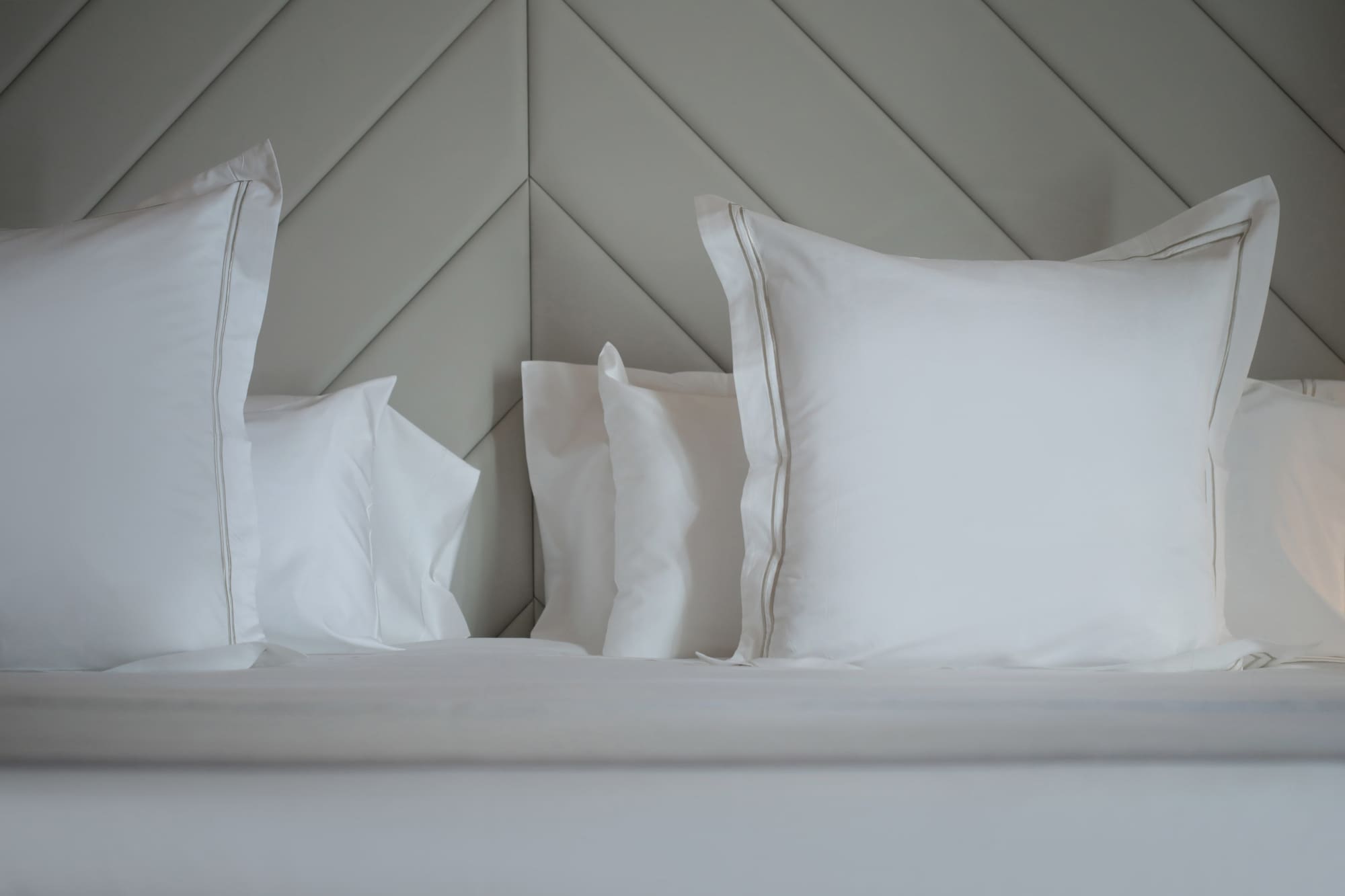 a bed with white pillows