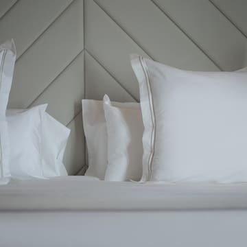 a bed with white pillows
