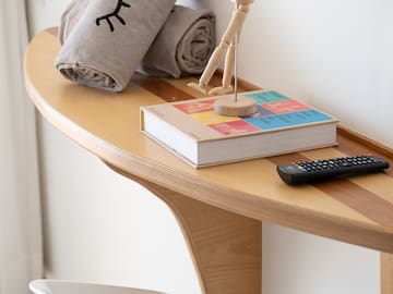 a wooden figurine on a table