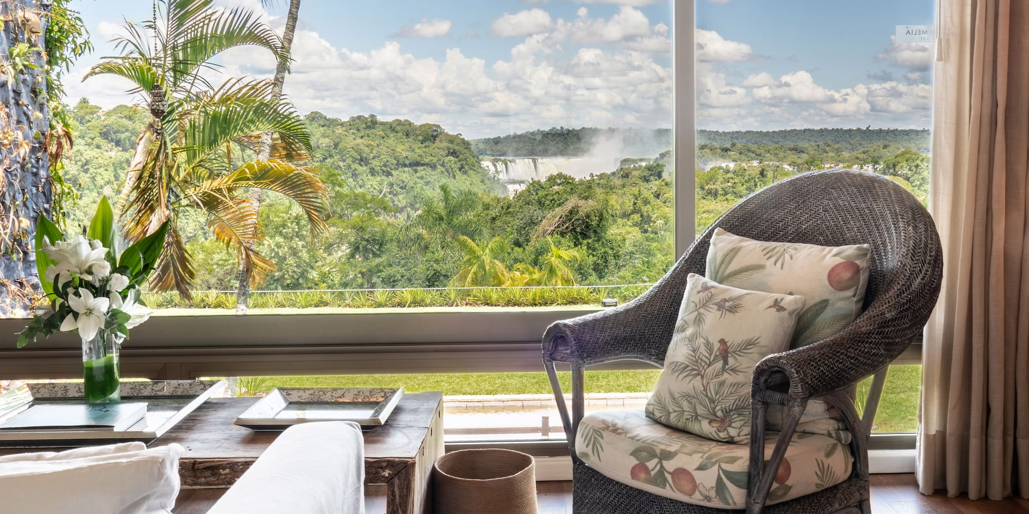 a room with a large window and a chair