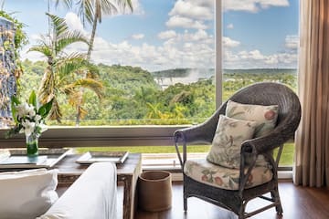 a room with a large window and a chair