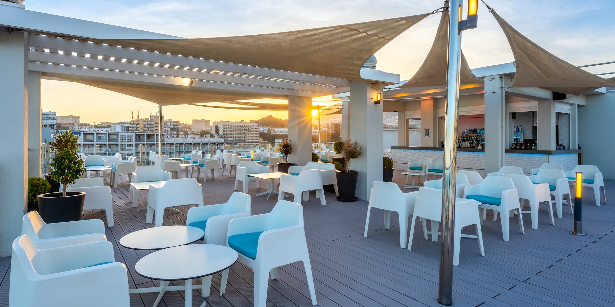 a patio with tables and chairs