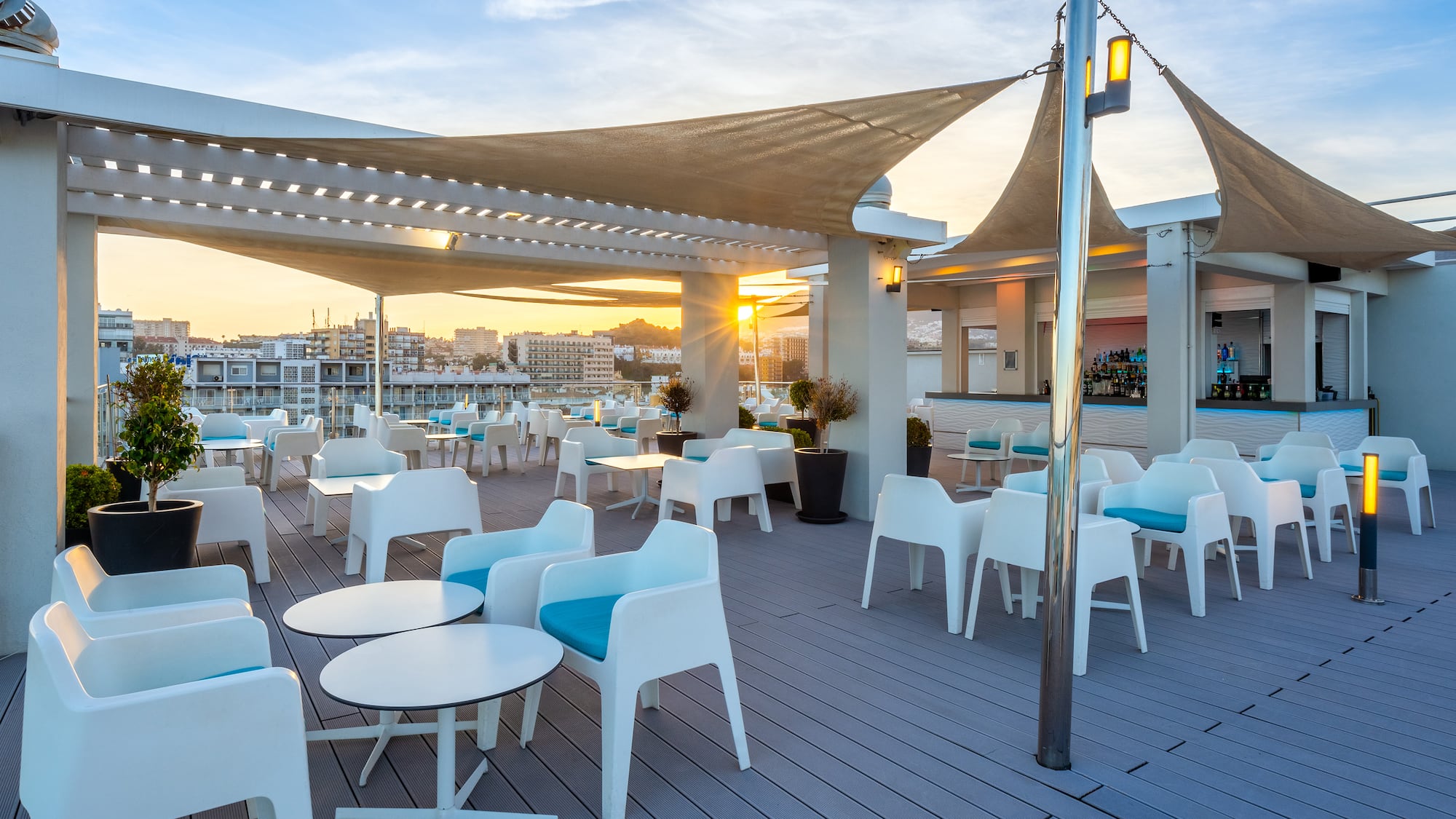 a patio with tables and chairs