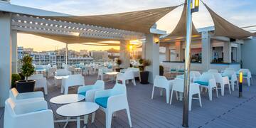 a patio with tables and chairs