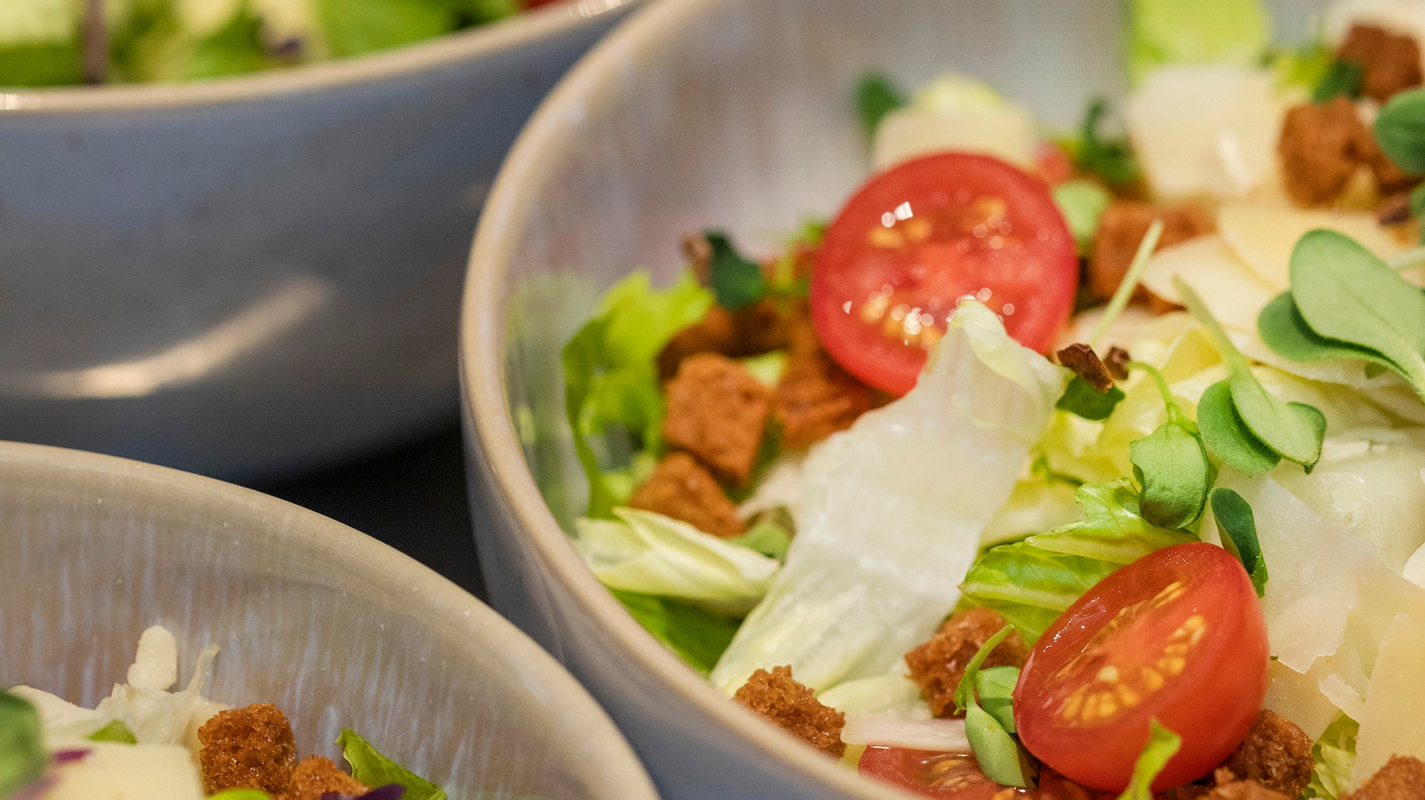 a group of bowls of salad