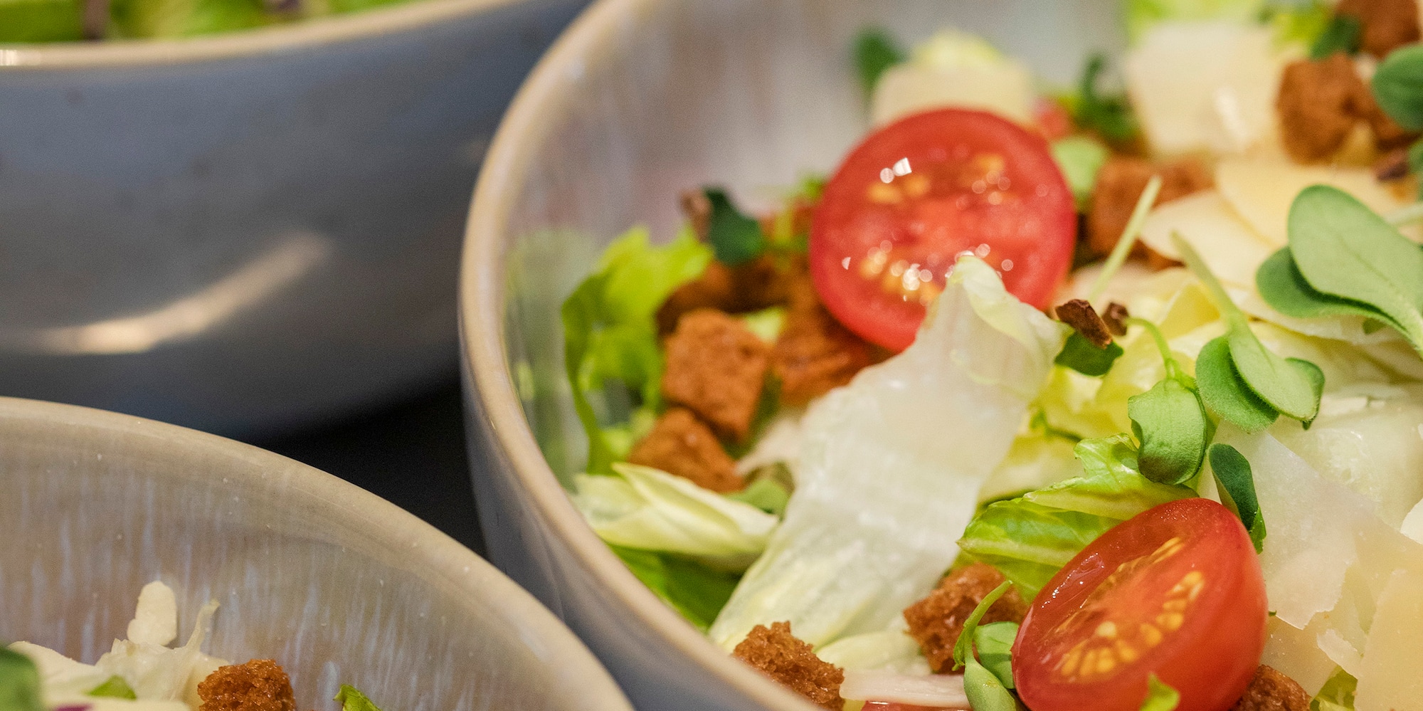 a group of bowls of salad