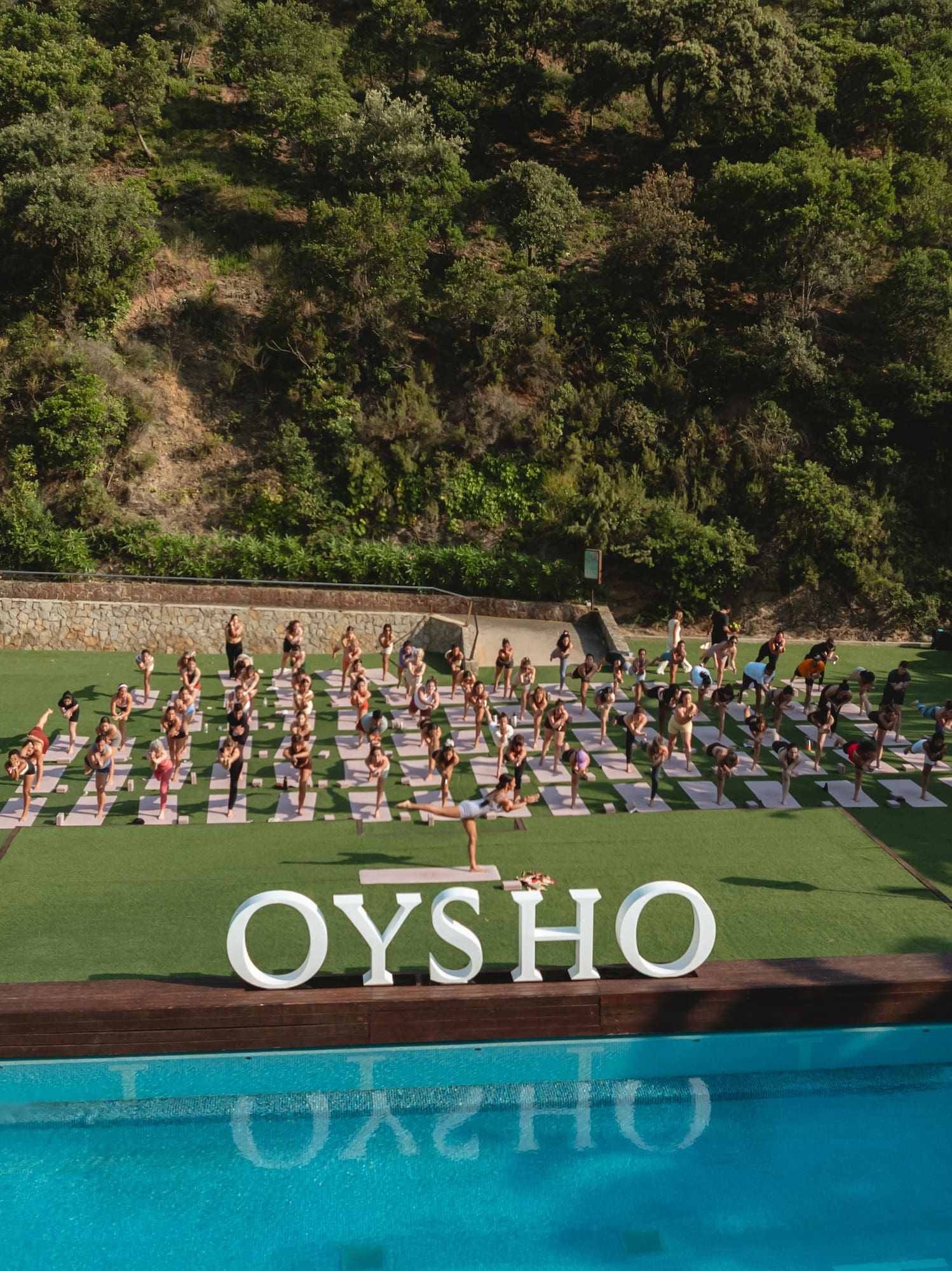 a group of people doing yoga outside