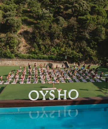 a group of people doing yoga outside