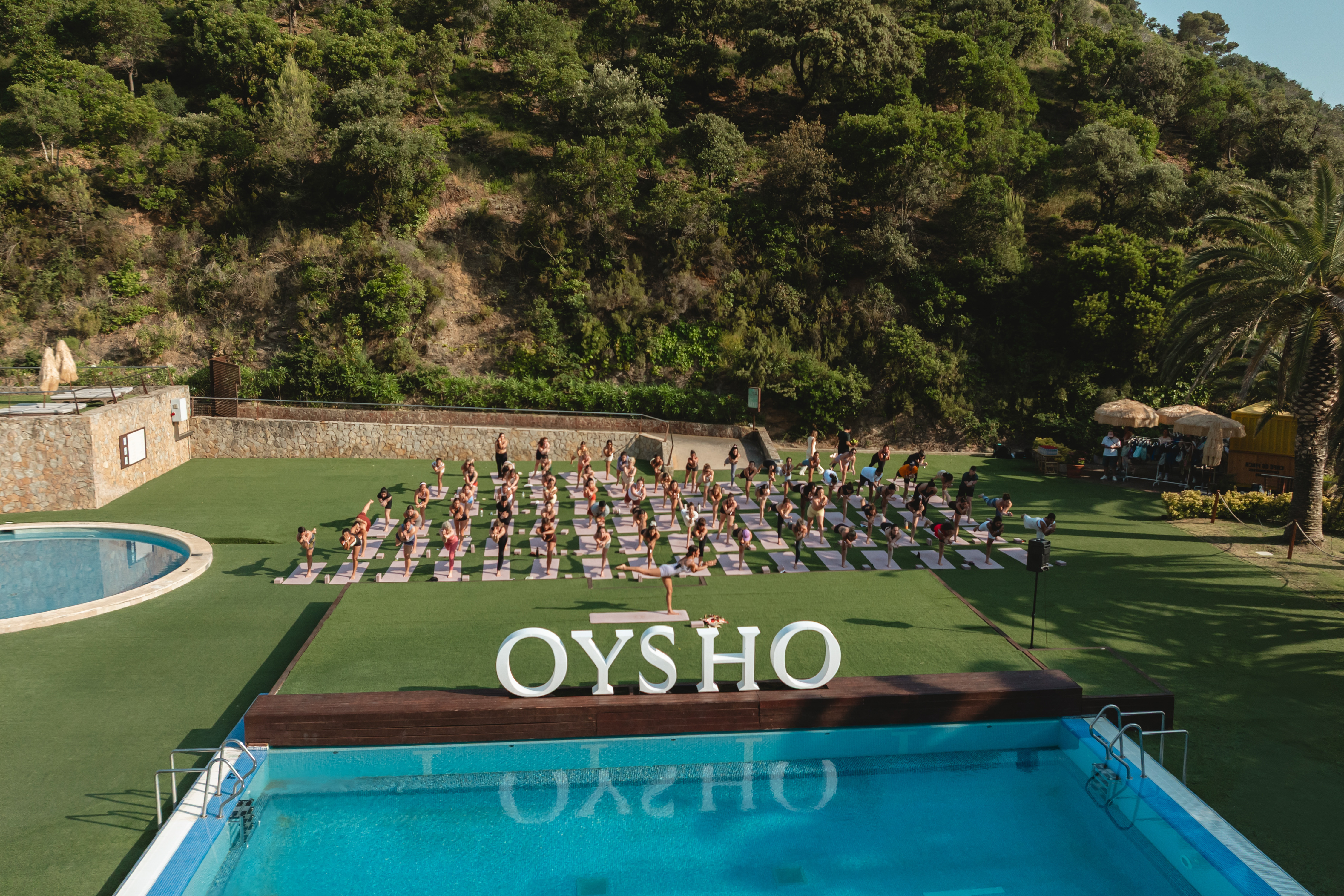a group of people doing yoga outside