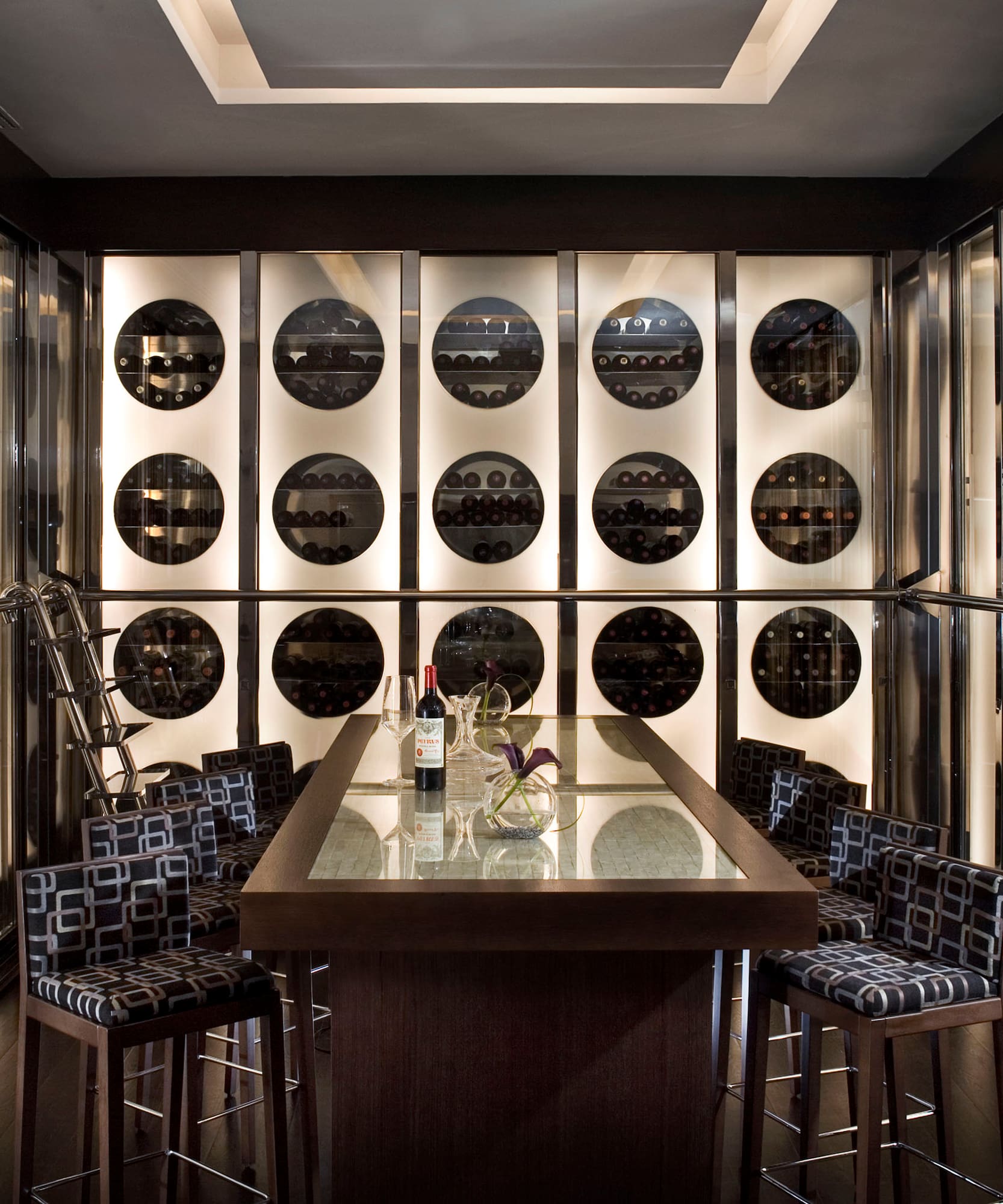 a wine cellar with a table and chairs