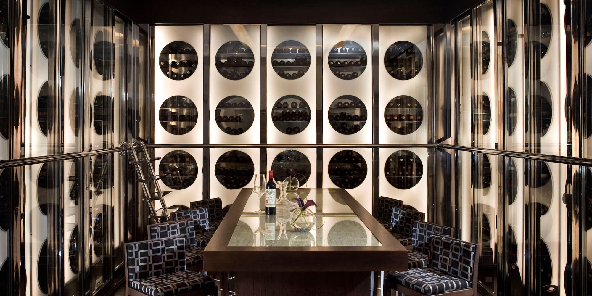 a wine cellar with a table and chairs