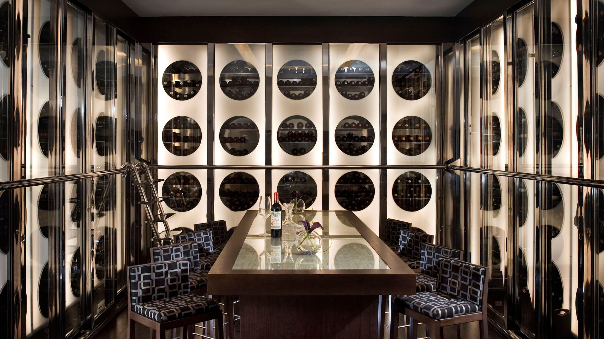 a wine cellar with a table and chairs