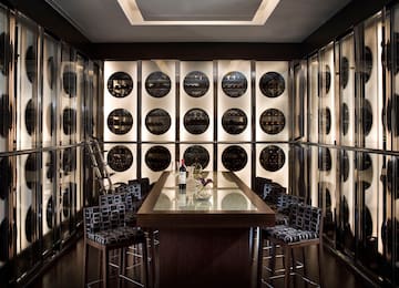 a wine cellar with a table and chairs