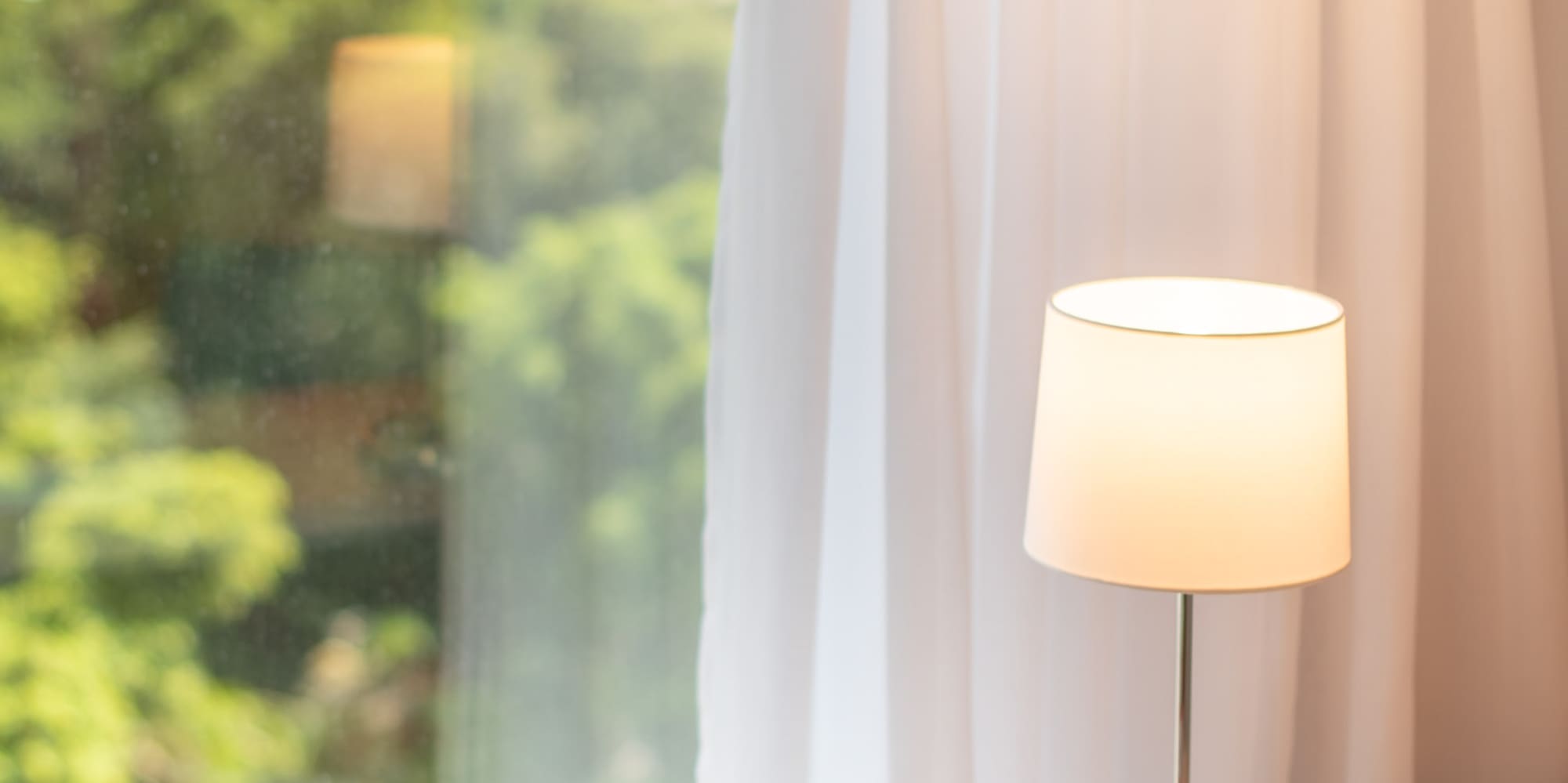 a book on a table next to a lamp