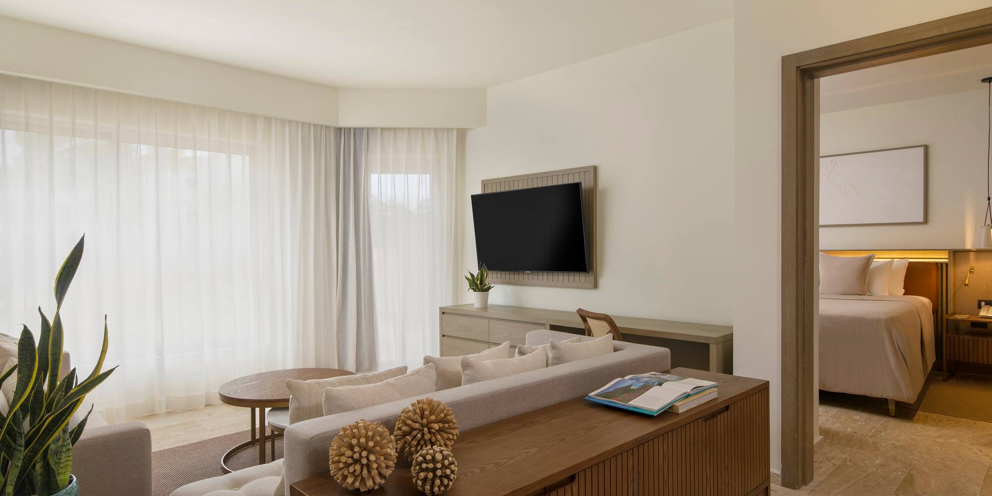 a living room with a tv and couch