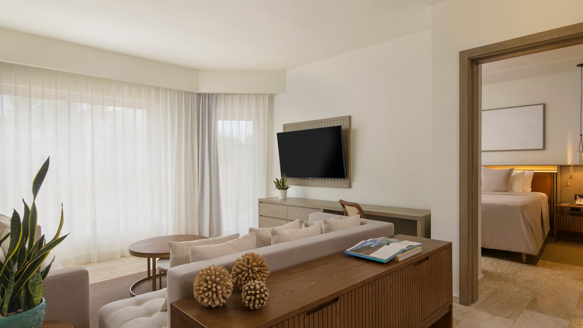 a living room with a tv and couch