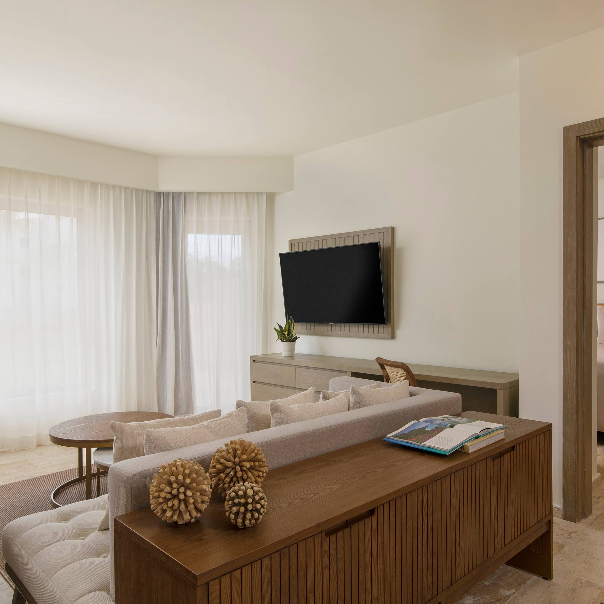 a living room with a tv and couch