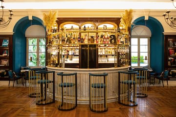 a bar with a bar and chairs