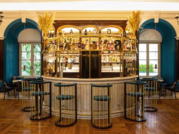 a bar with a bar and chairs