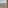 Coastal hotel balcony with panoramic city, hill, and sea view; outdoor seating.