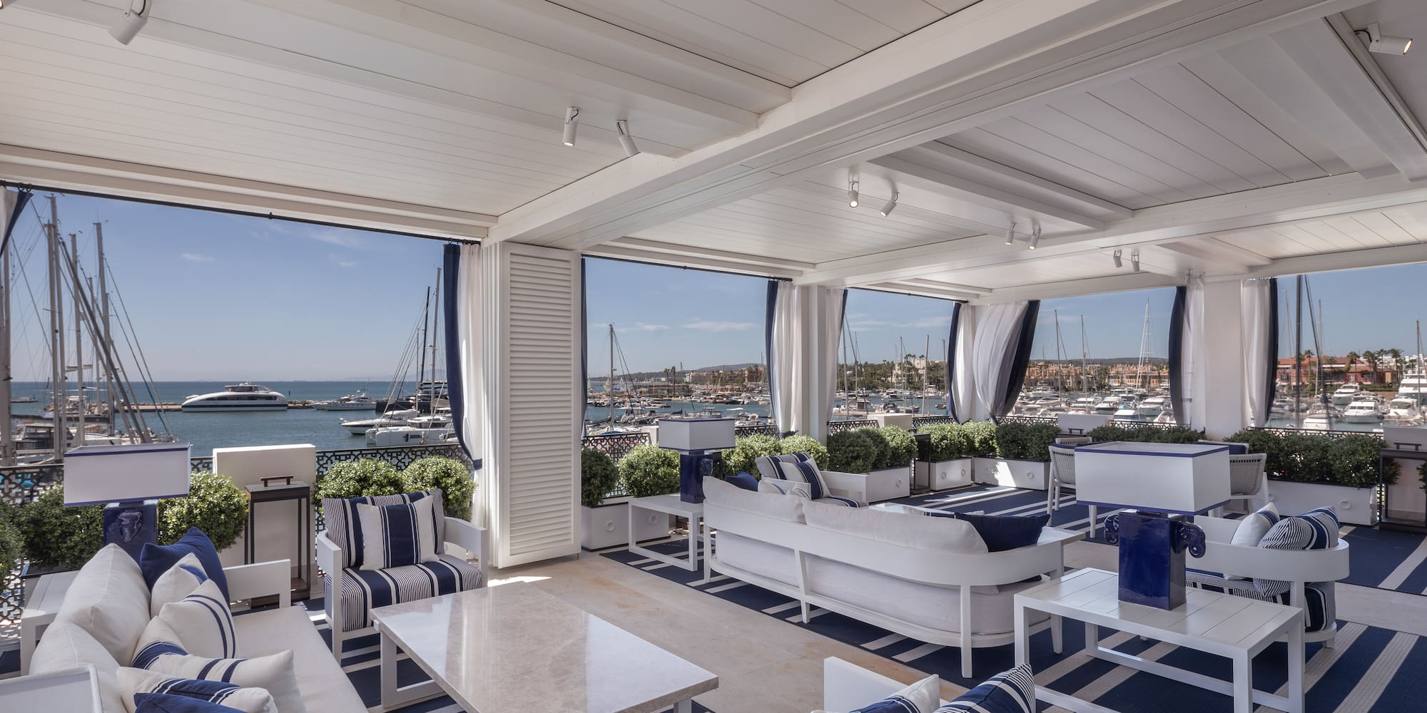a room with a view of boats and water
