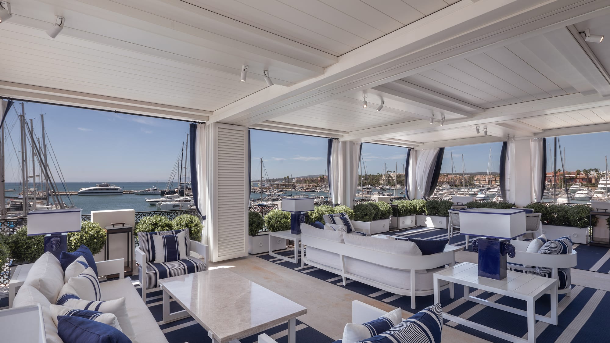 a room with a view of boats and water