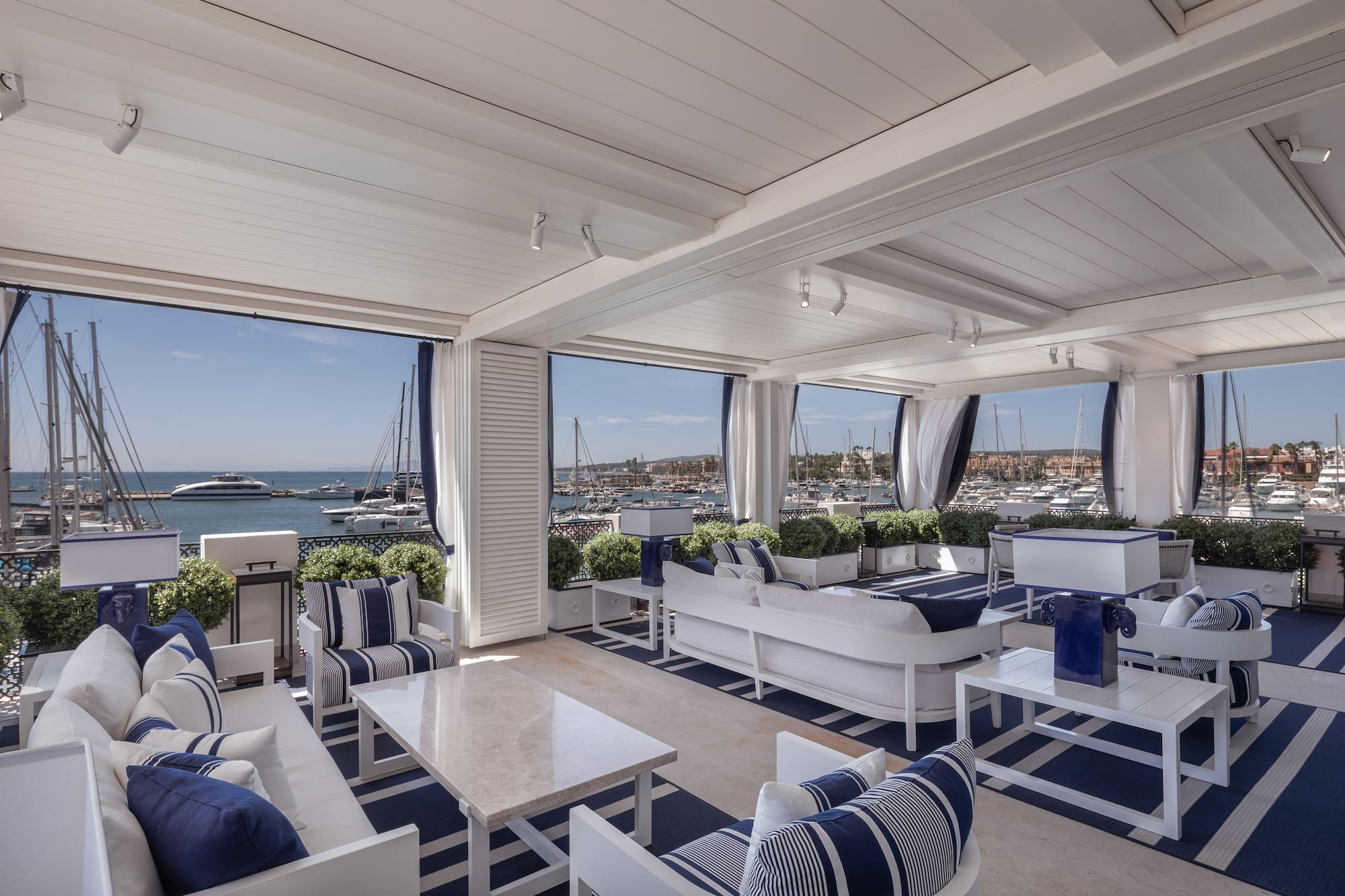 a room with a view of boats and water