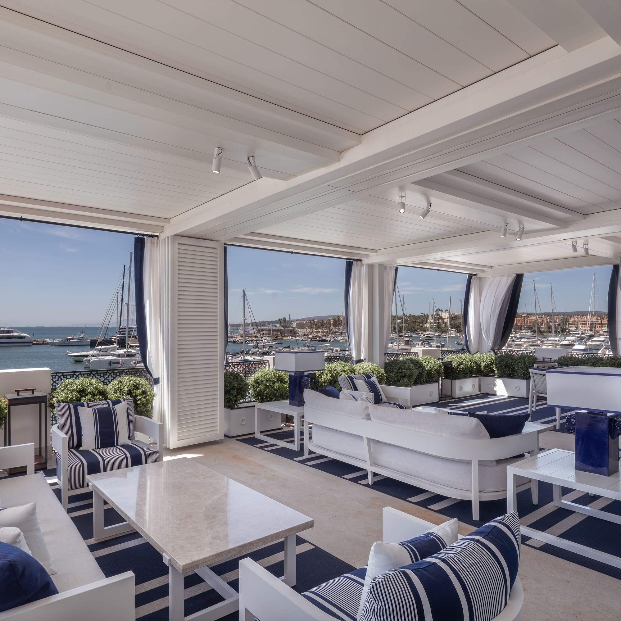 a room with a view of boats and water