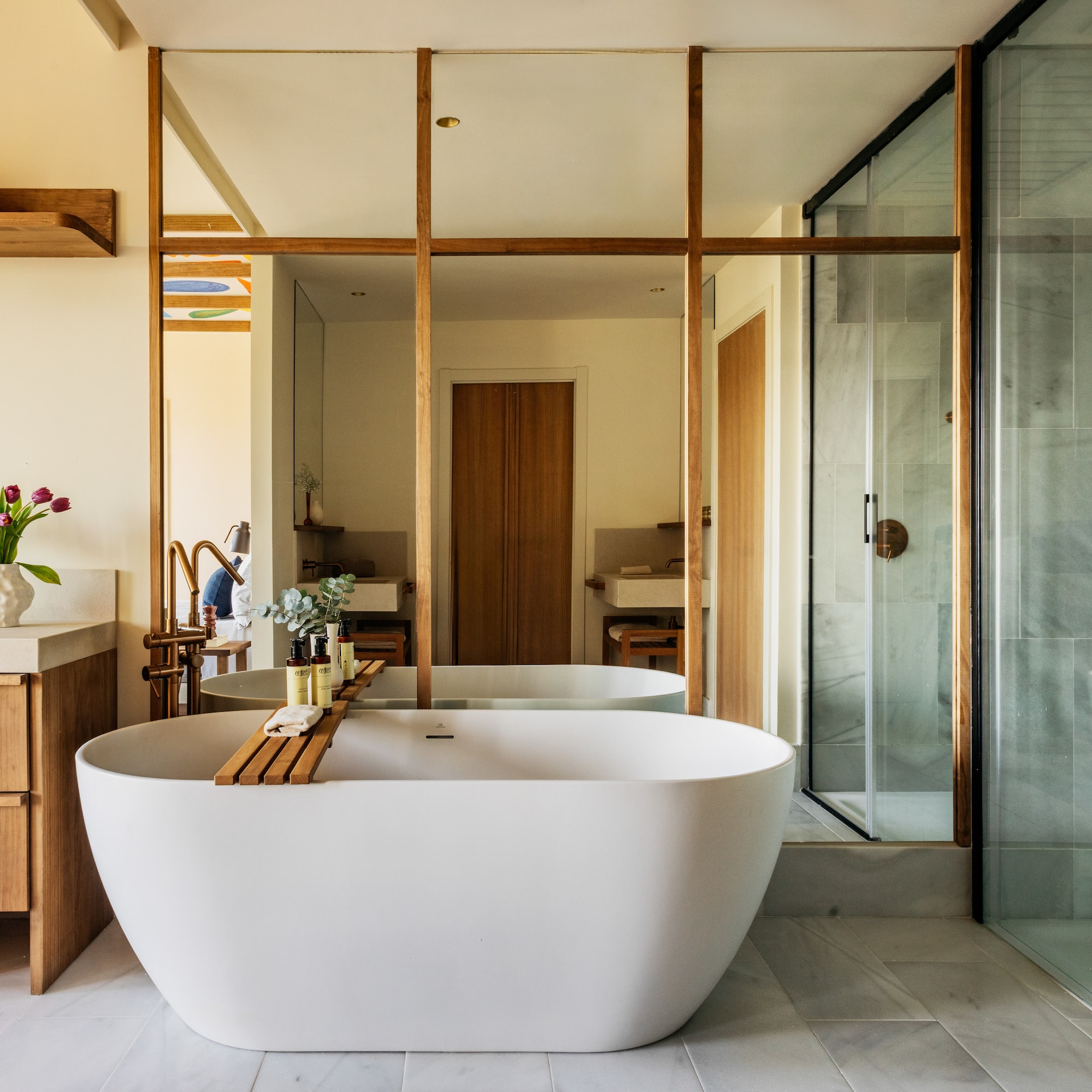 a bathroom with a tub and a shower