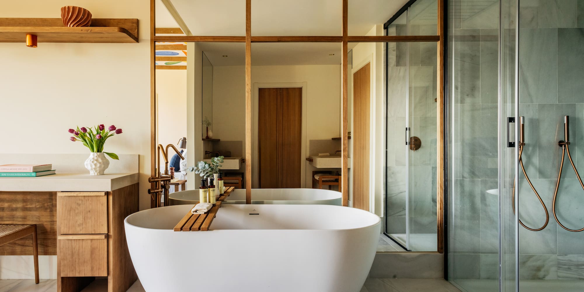 a bathroom with a tub and a shower