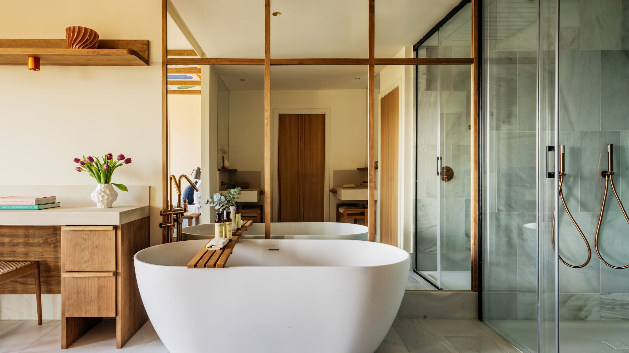 a bathroom with a tub and a shower
