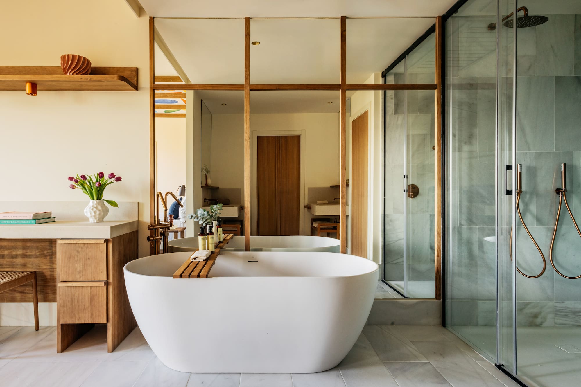 a bathroom with a tub and a shower