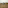 a vehicle driving through a grassy field