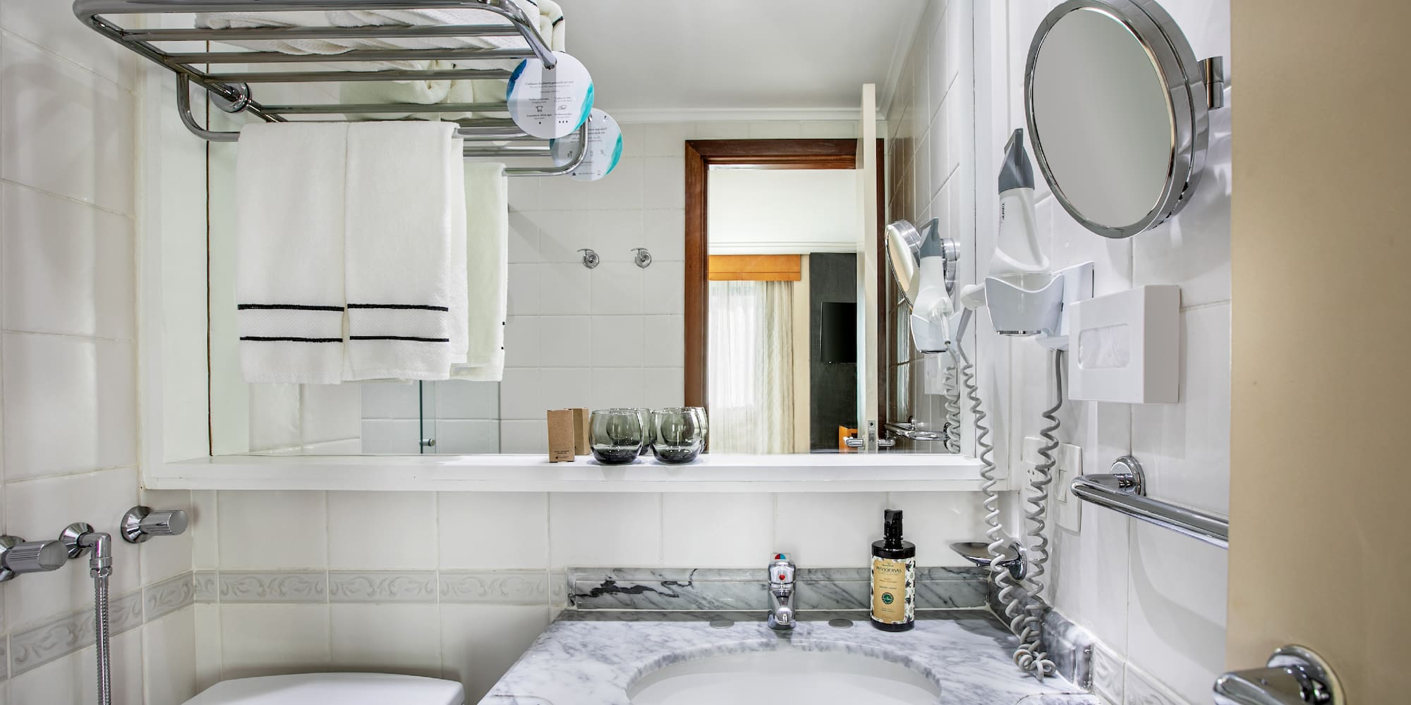 a bathroom with a sink toilet and a mirror