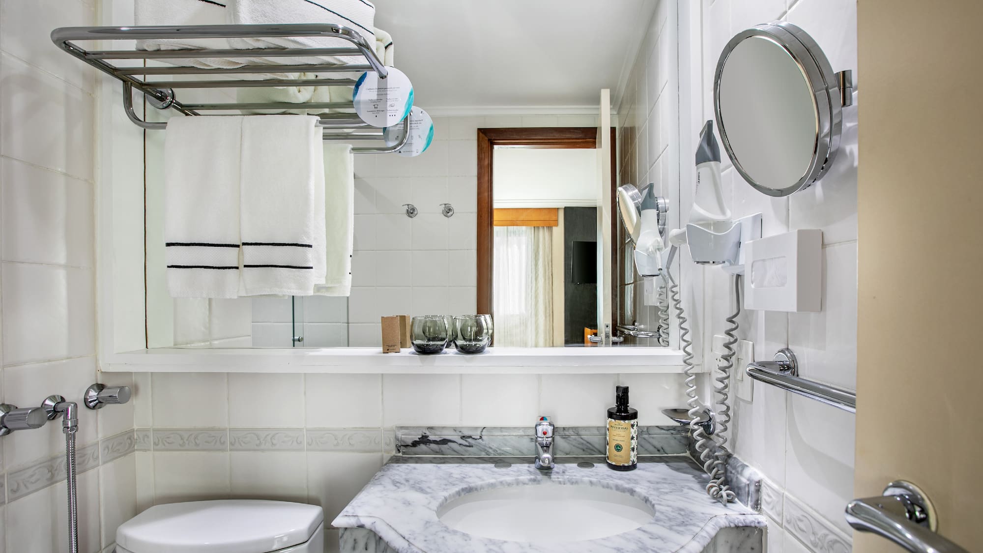 a bathroom with a sink toilet and a mirror