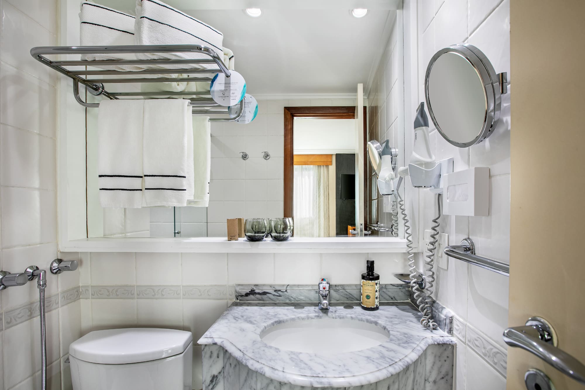 a bathroom with a sink toilet and a mirror